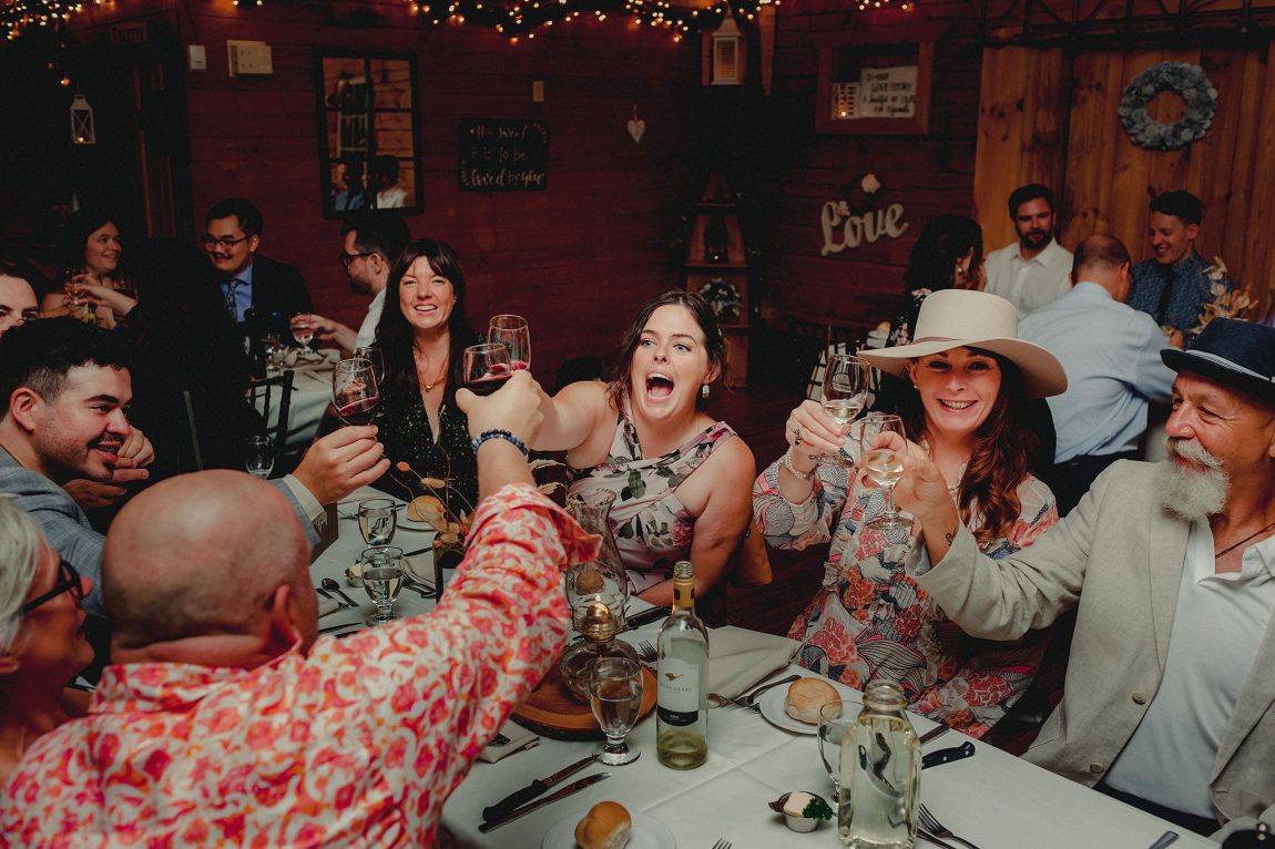 Guests toast at wedding at Bean Town Receptions