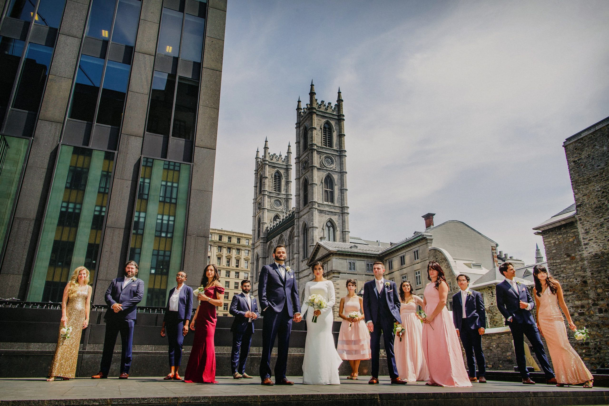 Bridal party photo in front of Notre Dame Basilica in Montreal